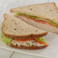 Signature Tuna Salad Sandwich · Our dolphin safe, signature tuna salad with lettuce and tomato.