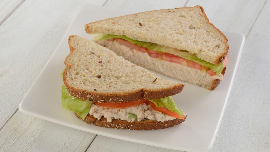 Signature Tuna Salad Sandwich · Our dolphin safe, signature tuna salad with lettuce and tomato.