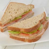 All Natural Turkey · All Natural Turkey Breast topped with Romaine and Tomato.