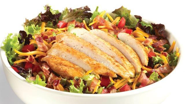 Grilled Or Crispy Chicken Club Salad · Choice of grilled chicken breast or lightly breaded, crispy chicken tenders served on Romaine and iceberg lettuce with chopped smoked bacon, fresh diced tomatoes, grated Cheddar cheese and a choice of dressing.