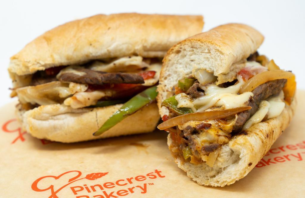 Philly Cheese Steak · Steak, provolone, onion, green and red pepper, and baguette.