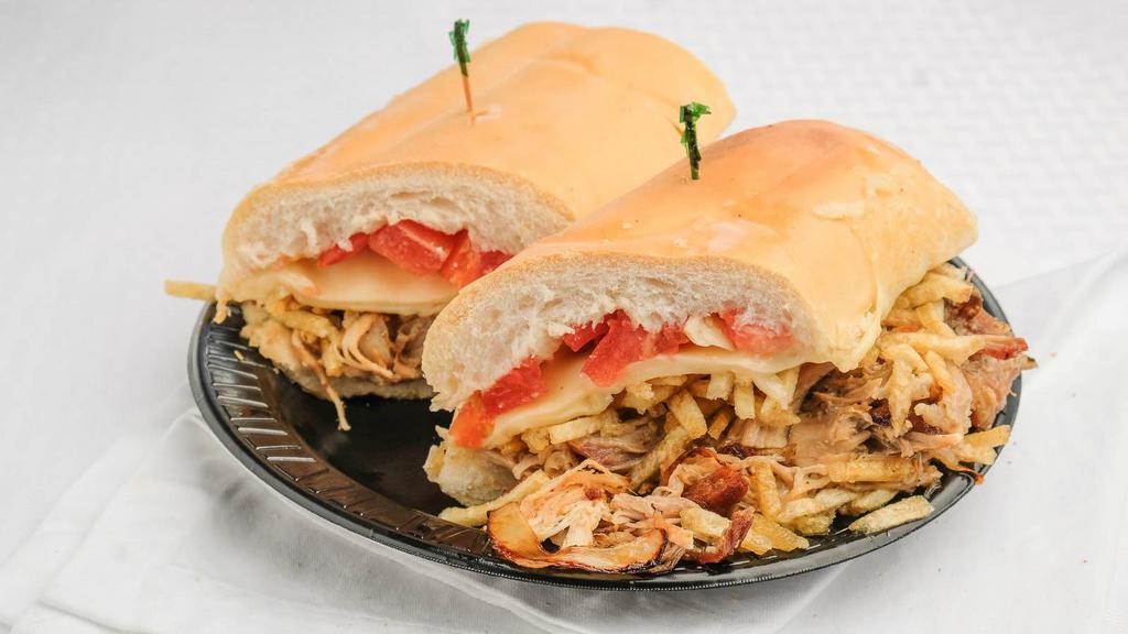 Frita Cubana · Cuban Frita on cuban bread served with potato sticks and ketchup