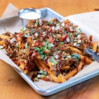 Loaded Fries - Hickory Smoked Pulled Pork · piled high seasoned fries · hickory smoked pulled pork · cheddar · pepper jack · bacon bits ...