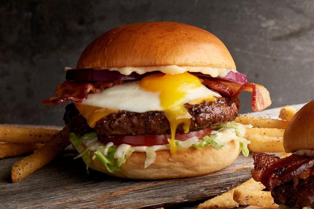 The Hangover · fried egg · bacon · American cheese · lettuce · tomato · red onions · mayo · served with seasoned French fries