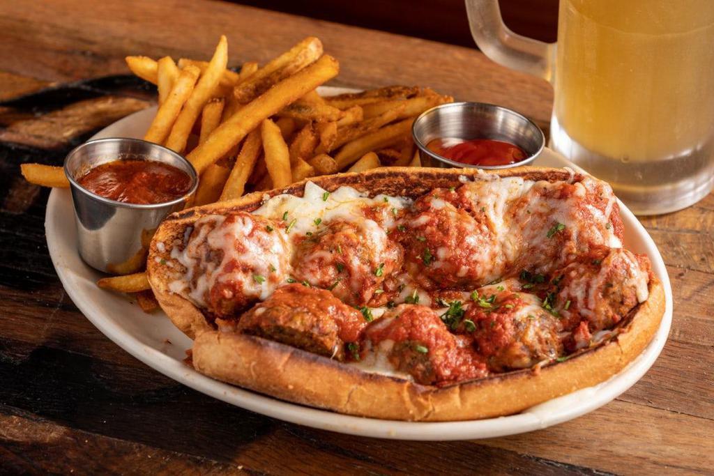 Spicy Meatball Parmesan · all-beef house made meatballs · marinara made in-house with San Marzano tomatoes · mozzarella · Parmesan · parsley · toasted hoagie roll · served with seasoned French fries
