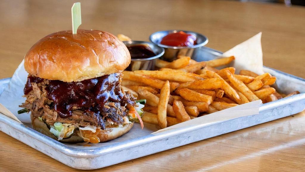 Pulled Pork · in-house smoked pulled pork · creamy coleslaw · pickles · sweet & smoky BBQ sauce · served with seasoned French fries