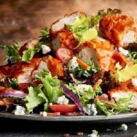 Crispy Buffalo Chicken · crispy buffalo chicken tenders · mixed greens · bacon · red onions · tomatoes · celery leave...