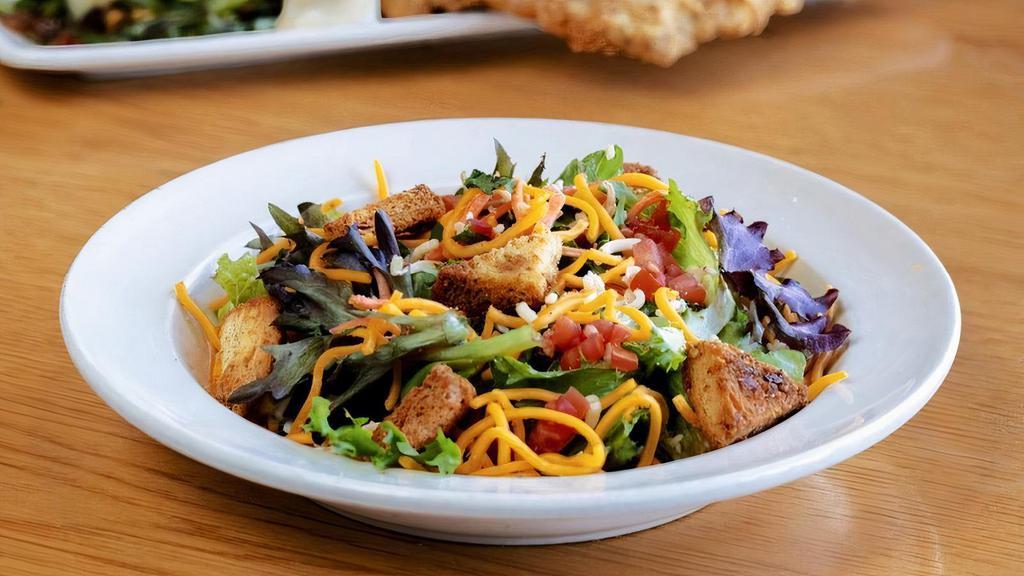 House Salad · mixed greens · tomatoes · pepper jack · cheddar · cilantro · croutons · choice of dressing