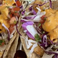 Baja Tilapia Fish Taco ( 1 ) · Tilapia battered fried tilapia. Served with pico de gallo cabbage. Topped with chipotle ranc...