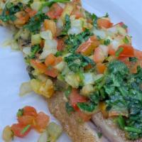 Corvina · Fresh filet of corvina prepared the Caribbean way on a hot grill with lots of onions, fresh ...