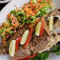 Pargo Entero · Whole snapper fried to perfection served with plenty of lemons.