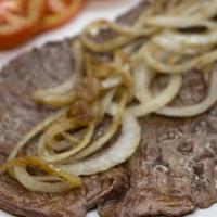 Bistec De Palomilla · Marinated top sirloin grilled and served with 
