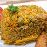 Arroz Con Pollo · This traditional dish is comprised of shredded chicken, vegetables and yellow rice.