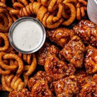 22  Boneless Wings Combo · 22 boneless wings  tossed with your choice of 2 flavors. Served with curly fries, a side of ...