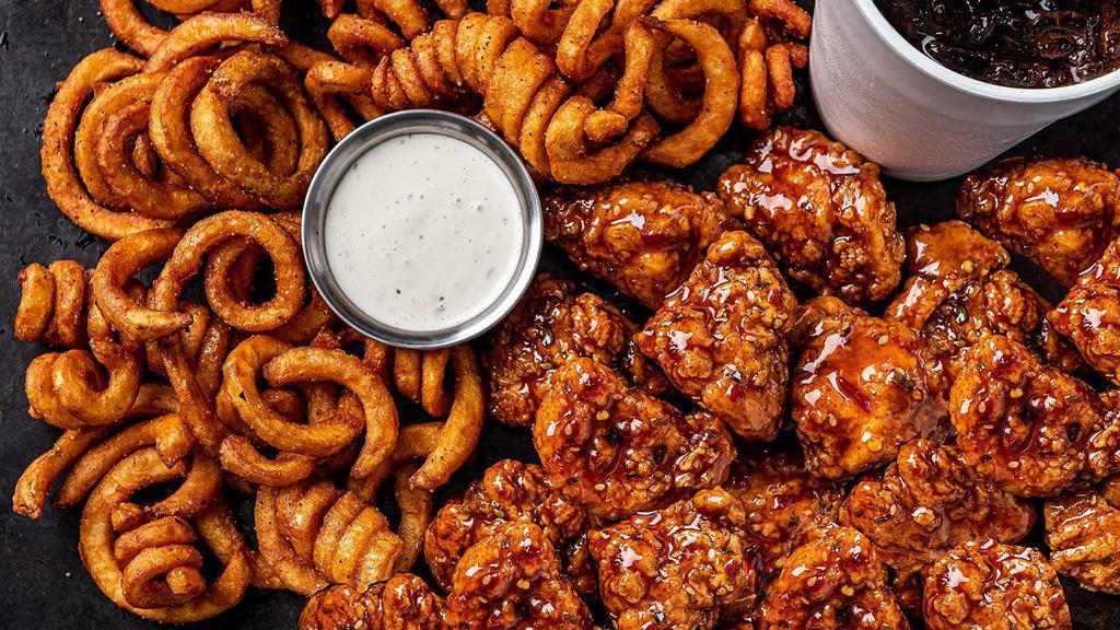 22  Boneless Wings Combo · 22 boneless wings  tossed with your choice of 2 flavors. Served with curly fries, a side of ranch & a drink