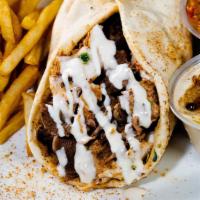 Chicken Shawarma · This is our juicy and seasoned chicken shawarma that comes with garlic and tahini sauce wrap...