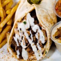 Beef Shawarma · Our special beef shawarma comes with your choice of vegetables, tahini and garlic sauce.