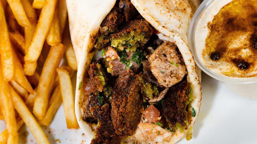 Falafel Wrap · Our signature falafel sandwich comes with hummus cream and tahini sauce wrapped in pita bread.