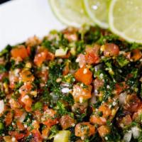 Tabule Salad · Fresh Parsley, tomatoes, onions dressed with lemon and peppermint.