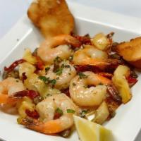 Shrimp Bada Bing · Sauteed shrimp in garlic olive oil, capers, sundried tomatoes, and artichoke hearts.