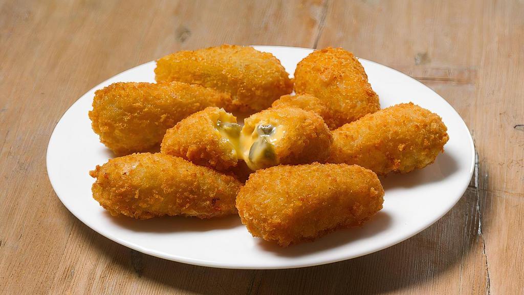 Jalapeño Cheese Bombers® · Fried spicy jalapeño bits and creamy cheddar cheese. More than just a burst of spice, it’s a delicious explosion of flavors. Crispy, then smooth, with a buttery kick of spice in every bite.