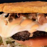 Toston Burger · 8 oz beef burger, our delicious toston burger is unless and served between two fried green p...