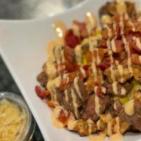 Two Meats Kernel Corn · Served with mozzarella cheese, special sauce, smashed potato chips, and sauces (Pink and spe...
