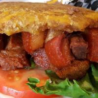 Chicharron Tostones · Fried pork bellies.