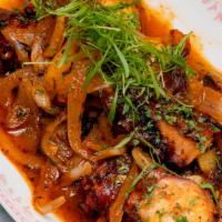 Garlic Octopus · Tender Octopus, Thinly sliced  garlic, extra virgin olive oil, onion, bright paprika and a t...