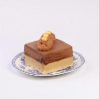 Marrockesh Slice · A fantastic cookie base with white chocolate and peanut mousse, dark chocolate, and milk cho...