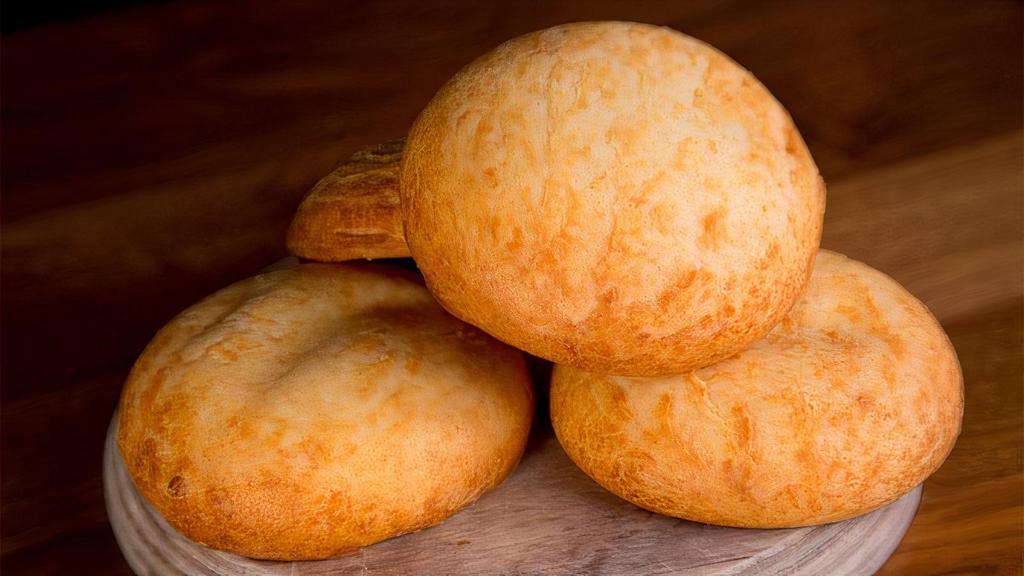 Pan De Bono · A Colombian tradition, very similar to the Brazilian cheese bread, made with cassava starch and cheese in the dough, baked in house.