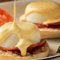 Traditional Eggs Benedict · Fresh Eggs with Canadian Bacon over Toasted Muffins, side order of Roasted Tomato & Asparagu...