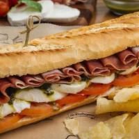 Prosciutto & Mozzarella Sandwich · Thin slices of Prosciutto, fresh Mozzarella Cheese, Tomato & Pesto Dressing.