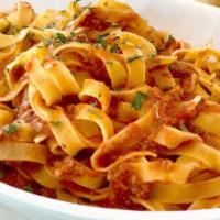Pasta Al Ragu · Our Famous Homemade & timeless slow cooked Bolognese sauce.