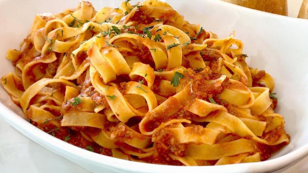 Pasta Al Ragu · Our Famous Homemade & timeless slow cooked Bolognese sauce.
