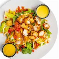 Chicken Tender Salad · Our house salad topped with hand-breaded chicken tenders.