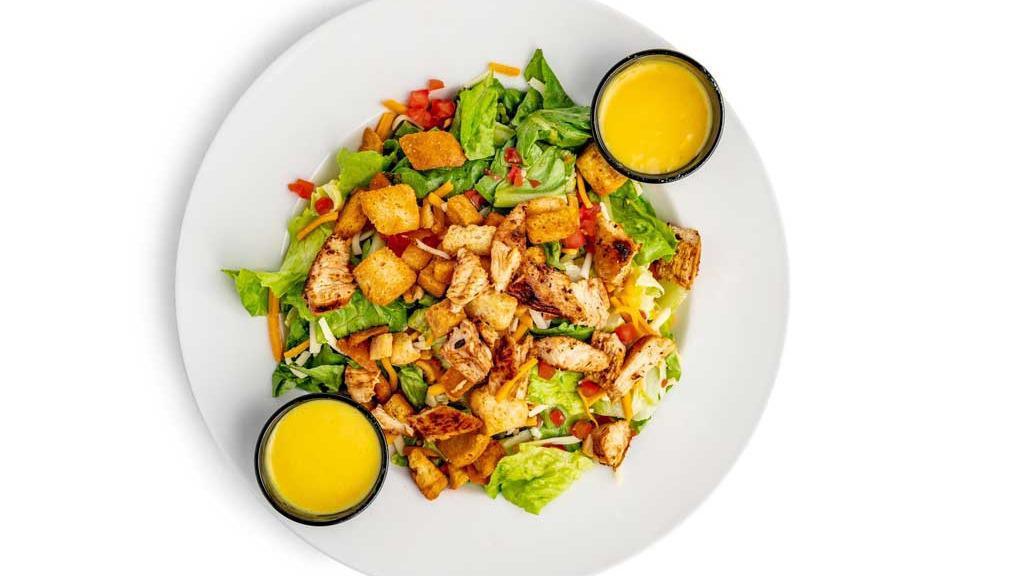 Grilled Chicken Salad · Our house salad topped with fresh to order grilled chicken breast.