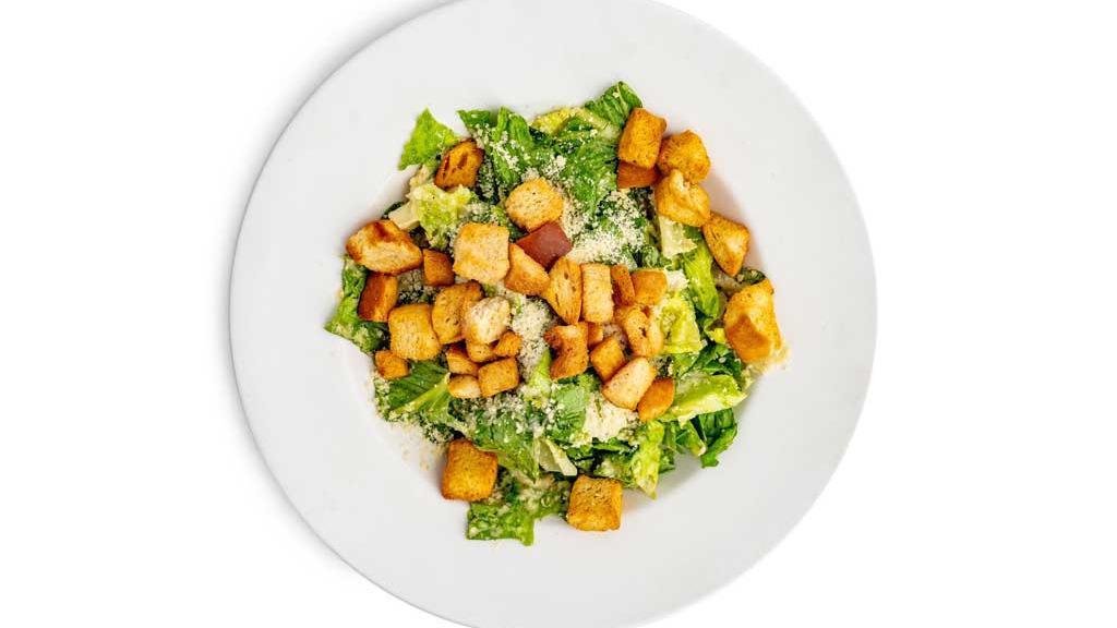 Caesar Salad · Fresh romaine lettuce with Parmesan cheese and croutons tossed in our creamy caesar dressing.