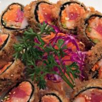 Crunchy Roll · Flash fried salmon, tuna, white tuna, crab, carrot, masago, asparagus with eel sauce.