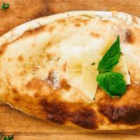 Calzone Tatore Special · Tomato sauce, mozzarella, ham, bacon, red peppers and shaved parmigiano.