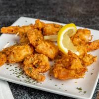 Buffalo Shrimp · 8 fresh white tiger shrimp hand breaded and tossed in your choice of sauce.