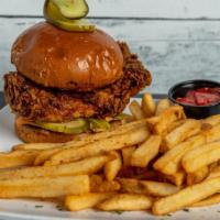 Playhouse Spicy · Breaded chicken sandwich covered in chipotle sauce with pickles and served with house fries.