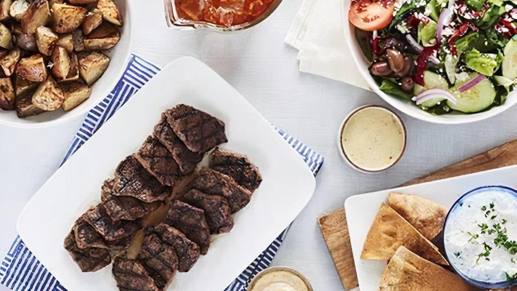 Grilled Beef Family Feast For 6 · Seasoned and chargrilled, and served with our homemade horseradish sauce. Includes a choice of salad with dressing, choice of side, and a choice of baked pita or soft pita
