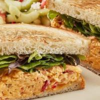 Spicy Pimento Cheese Sandwich · With mixed lettuce on toasted buttermilk bread. Served with chips and choice of a side.