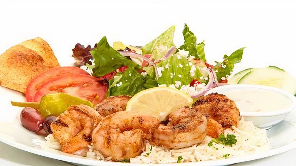 Grilled Shrimp Feast · Seasoned and grilled with lemon juice, butter, and blackened seasoning. Served with Greek salad and your choice of roasted new potatoes or basmati rice.