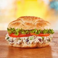 Chicken Salad · Freshly made chicken salad with lettuce and tomato on a flaky croissant. 560 cal.