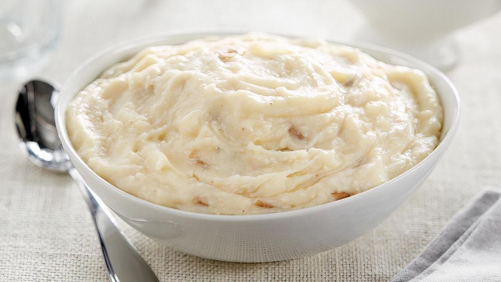 Creamy Russet Mashed Potatoes · Who can say no to a family favorite that takes no time at all! A perfect blend of butter and russet potatoes makes this dish a hit at any dinner party. Rich and creamy; all you do is bake to perfection. No one will know you didn't make this side dish from scratch!