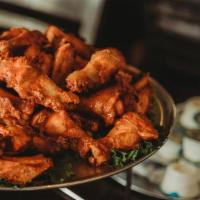 40 Wings · Forty jumbo wings dry rubbed, smoked, and baked with your choice of sauce.
