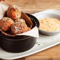 Mac & Cheese Bites · Award-winning bites made in our kitchen daily! Our spicy pepper jack Mac & Cheese hand rolle...