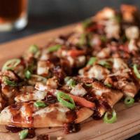 Chipotle Bbq Chicken Flatbread · Tender, grilled chicken with onions, peppers & bacon smothered in mozzarella cheese. Finishe...